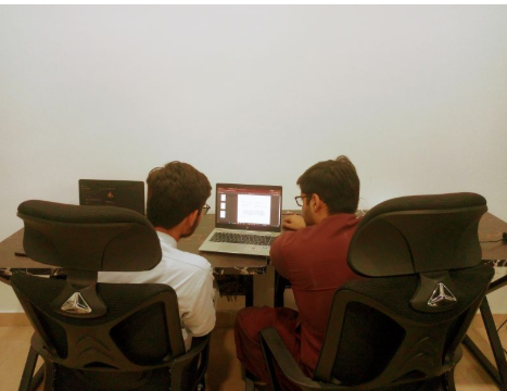 Two GrydIn teammates reviewing a project together