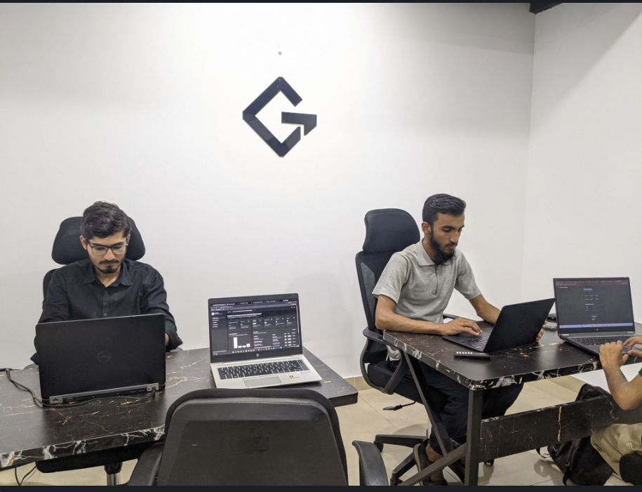 GrydIn teammates working side by side in the Islamabad office